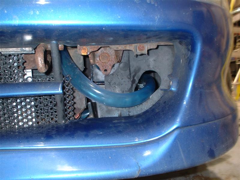 close up of cooling pipe through fog light hole